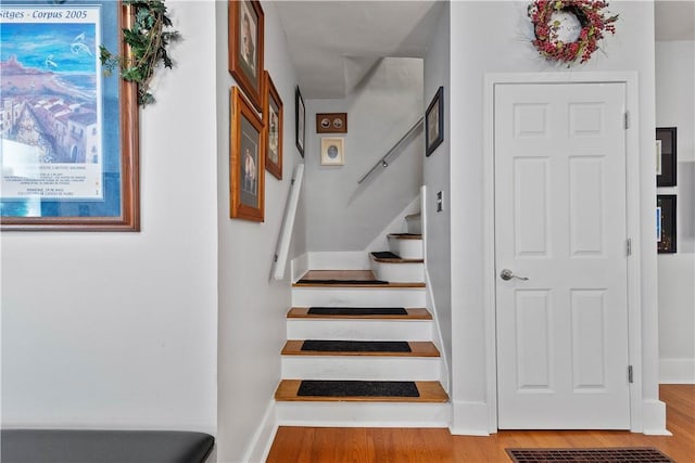 staircase featuring hardwood / wood-style floors