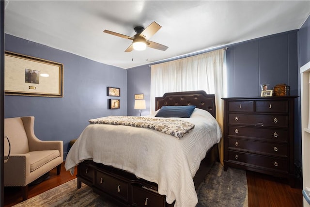 bedroom with ceiling fan and dark wood-type flooring