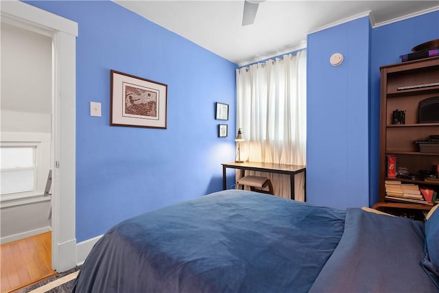 bedroom featuring ceiling fan and hardwood / wood-style floors