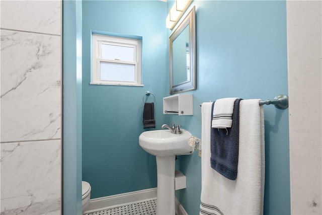 bathroom featuring sink and toilet