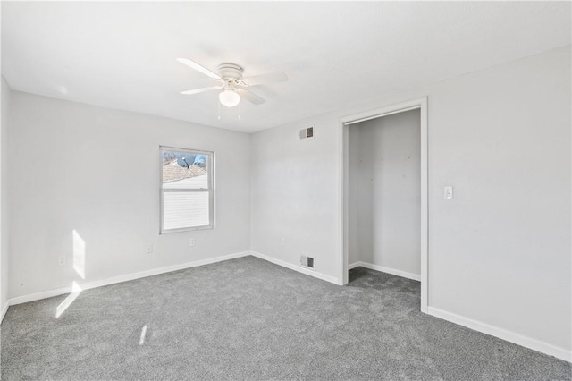 unfurnished room with carpet and ceiling fan