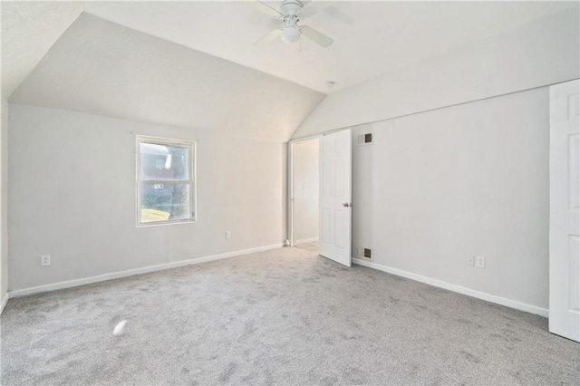 additional living space featuring ceiling fan, lofted ceiling, and light carpet