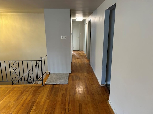 hall with dark hardwood / wood-style floors