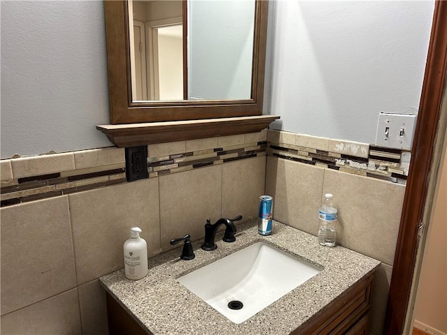 bathroom featuring tile walls and vanity