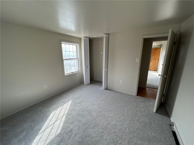 unfurnished bedroom with light carpet