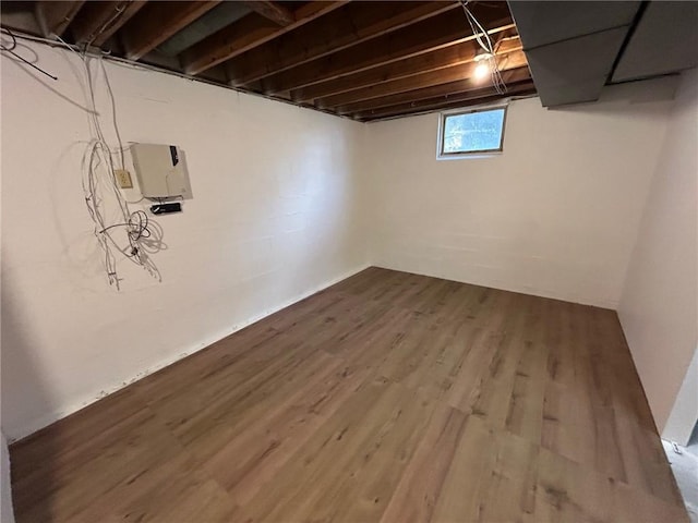 basement with wood-type flooring