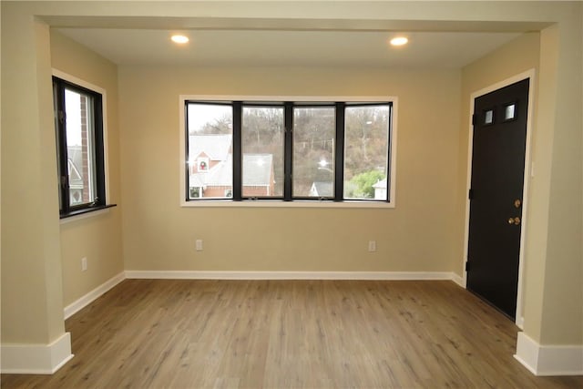 unfurnished room featuring light hardwood / wood-style floors