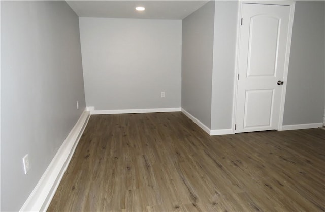 spare room featuring dark hardwood / wood-style flooring