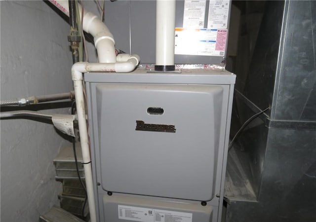 utility room with heating unit