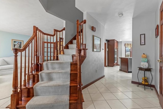 staircase with tile patterned floors