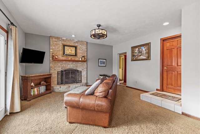 carpeted living room with a fireplace, baseboards, and recessed lighting