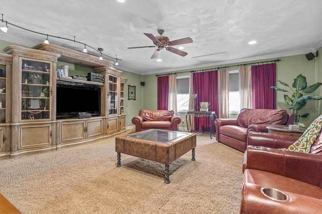 living area featuring a ceiling fan, crown molding, carpet flooring, track lighting, and recessed lighting