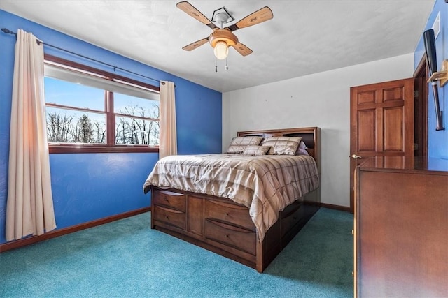 bedroom with dark colored carpet and ceiling fan