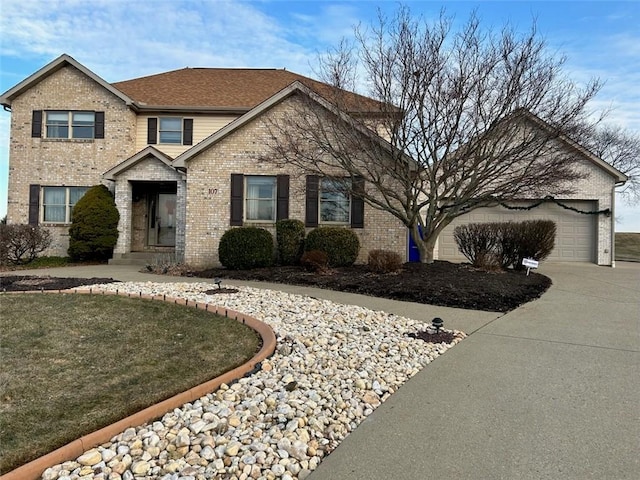 traditional home featuring a garage, concrete driveway, brick siding, and a shingled roof