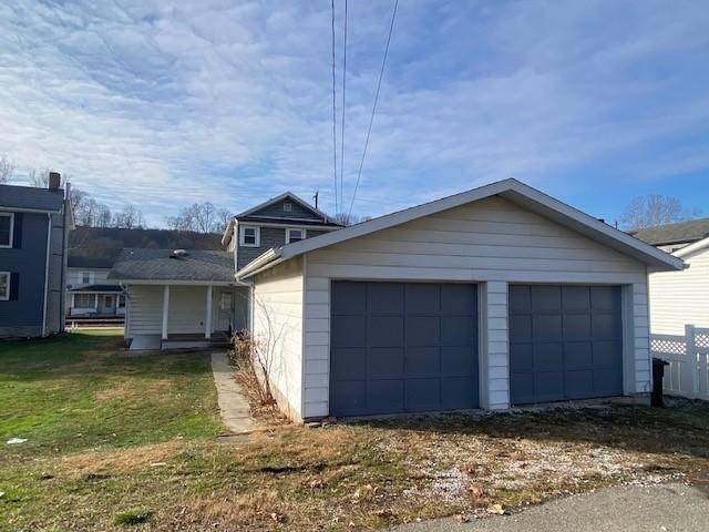 garage featuring a yard