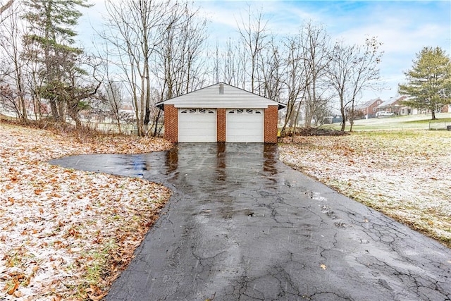 view of home's exterior with an outbuilding and a garage