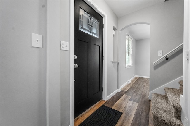 foyer entrance featuring dark wood-type flooring