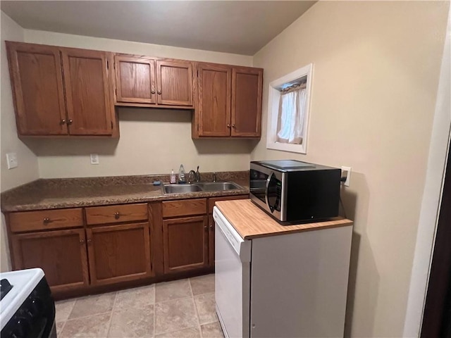 kitchen featuring black stove and sink