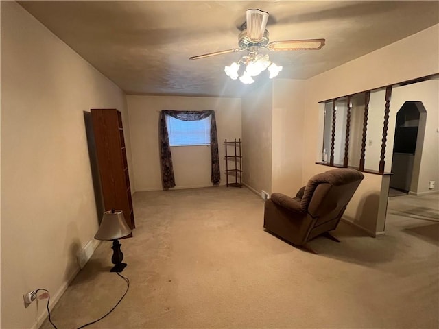 living room with light carpet and ceiling fan