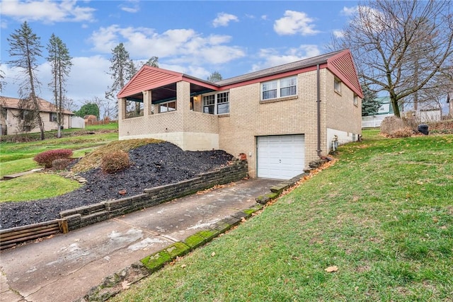 view of front of property with a garage and a front yard