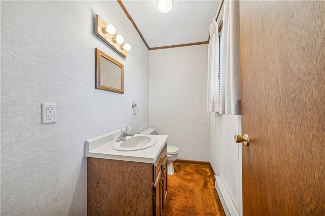 bathroom with vanity, toilet, and ornamental molding