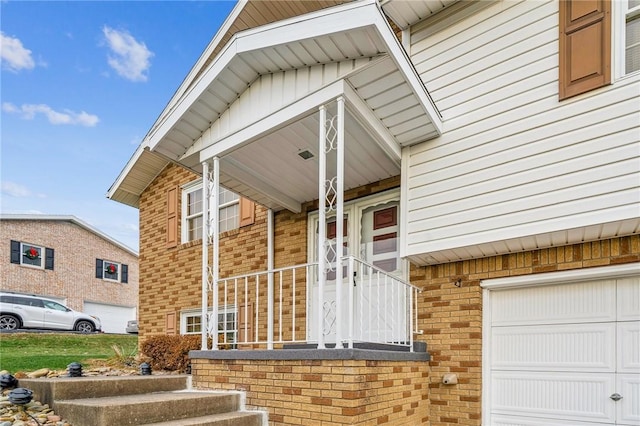 view of exterior entry featuring a garage