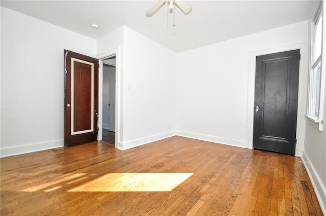 spare room featuring hardwood / wood-style floors and ceiling fan