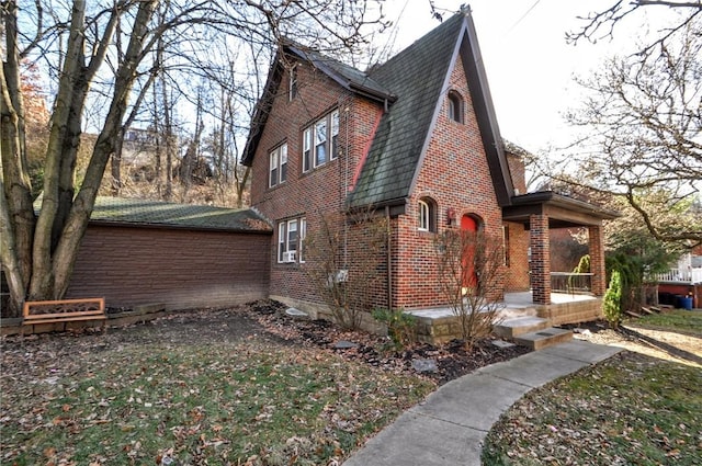 view of side of home with a porch