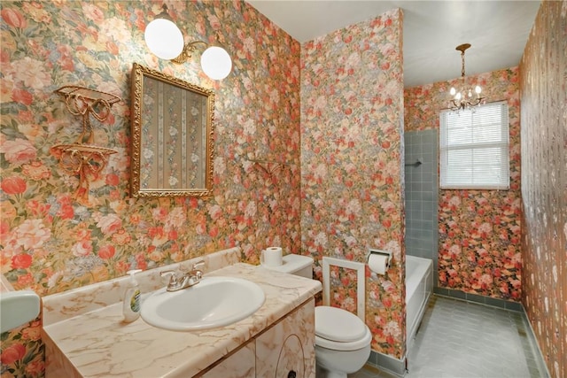 bathroom with toilet, vanity, a chandelier, and tile patterned floors