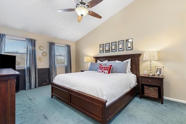 carpeted bedroom featuring multiple windows, lofted ceiling, and ceiling fan