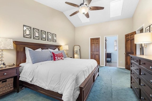 carpeted bedroom featuring lofted ceiling with skylight and ceiling fan