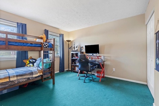 carpeted bedroom with a textured ceiling