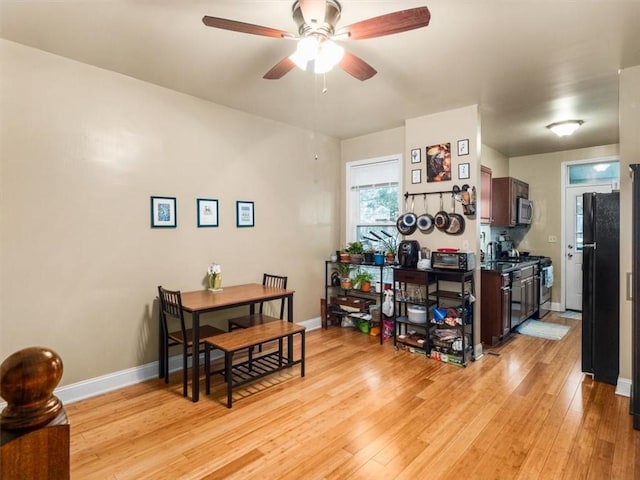 dining room featuring ceiling fan and light wood-type flooring