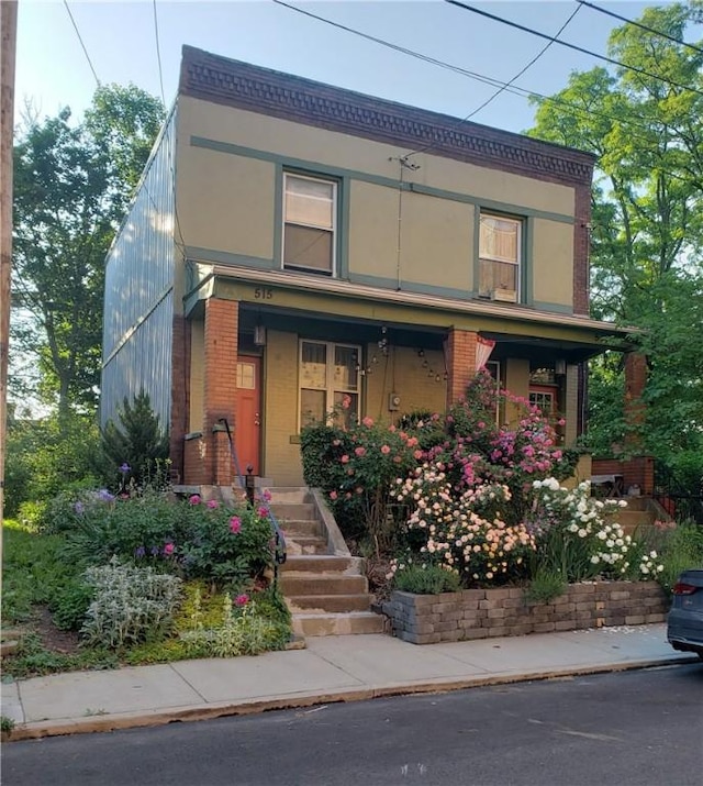 view of front of home featuring covered porch