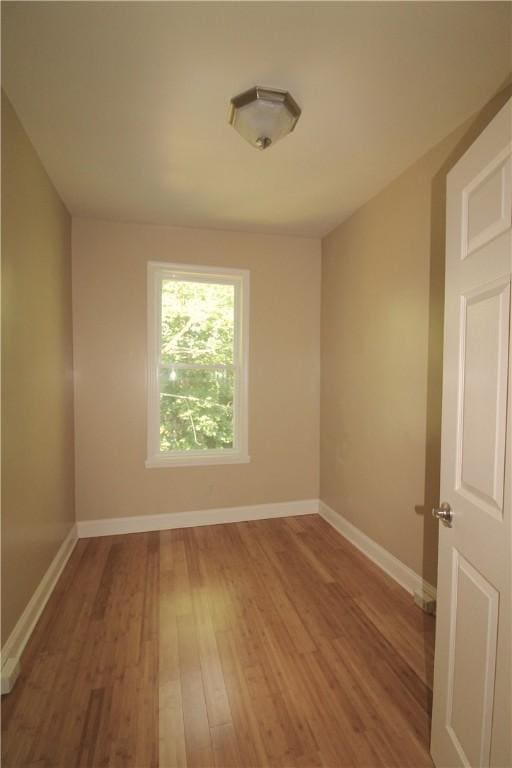 spare room with hardwood / wood-style flooring