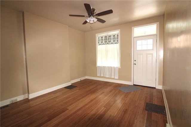 entrance foyer with ceiling fan and dark wood-type flooring