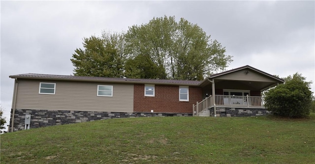 exterior space with a lawn and a porch