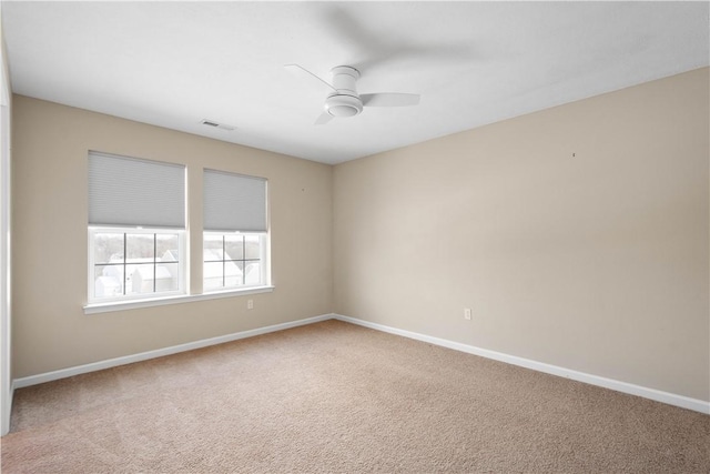 carpeted empty room with ceiling fan