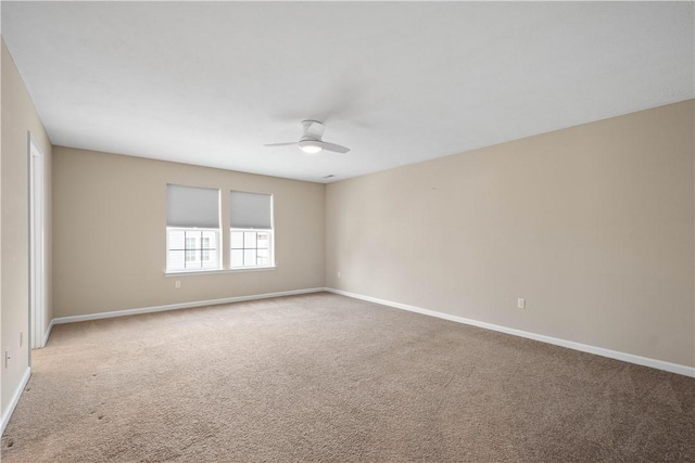 unfurnished room featuring light colored carpet and ceiling fan