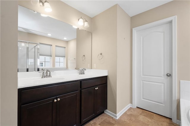 bathroom with plus walk in shower, vanity, and tile patterned flooring