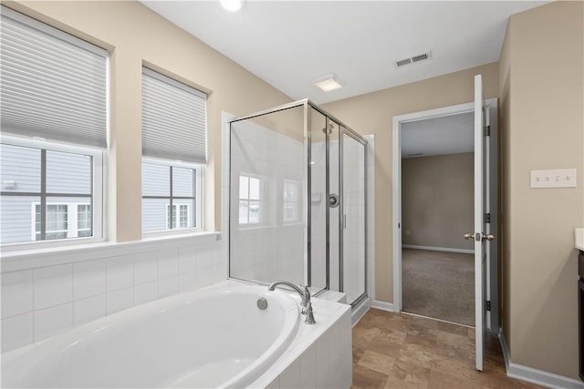 bathroom featuring separate shower and tub and vanity