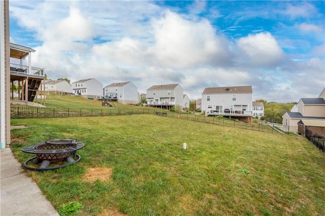 view of yard featuring an outdoor fire pit