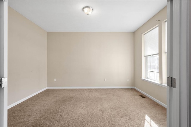 unfurnished room featuring carpet floors