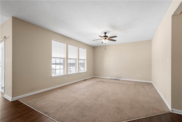 unfurnished room featuring ceiling fan and wood-type flooring