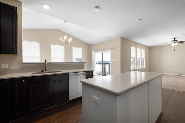 kitchen with sink, hanging light fixtures, stainless steel dishwasher, dark hardwood / wood-style floors, and ceiling fan with notable chandelier