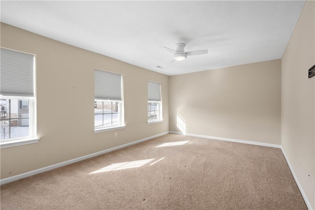 unfurnished room with carpet floors and ceiling fan