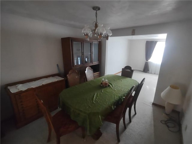 dining space featuring a notable chandelier