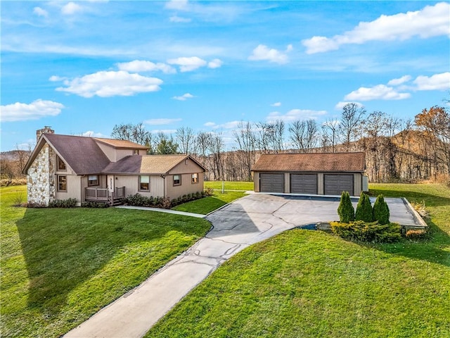 ranch-style house with a front yard, an outdoor structure, and a garage