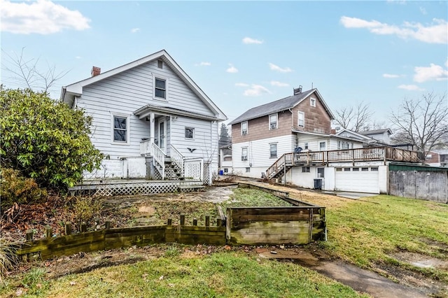 view of front of property with cooling unit, a front lawn, and a deck