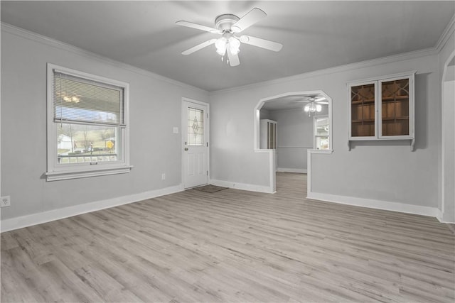 unfurnished living room featuring light wood-type flooring, ceiling fan, and ornamental molding